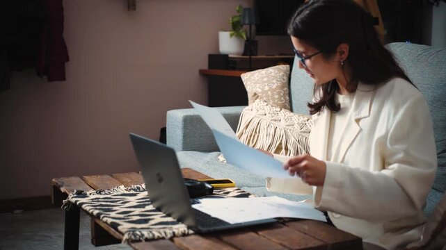 4K video of a joyful young businesswoman celebrating after paying off all company debts and achieving strong sales growth. Business success and financial freedom concept.
