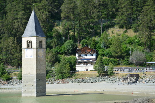 The old bell tower of the sunken church of Graun / Curon,  in lake Reschen / Resia, South Tirol, Italy