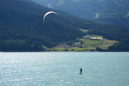Paragliding   in lake Reschen/Resia, South Tirol, Italy
