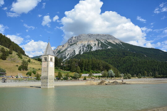 Old bell tower of the sunken church of Graun / Curon,  in lake Reschen / Resia, South Tirol, Italy