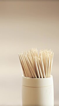 Tilt shot of person pick stylish toothpick close up