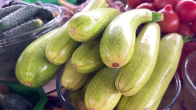fresh zucchini on the counter. fresh zucchini and slices healthy and versatile vegetable for culinary creations