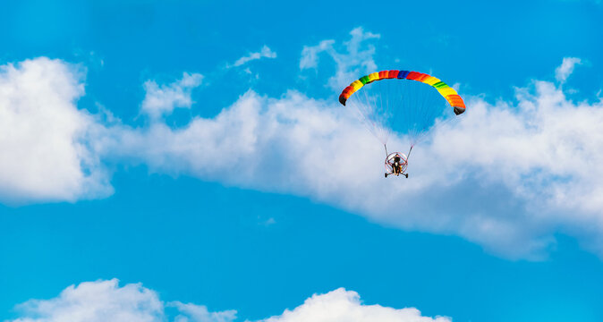 paragliding in the blue sky