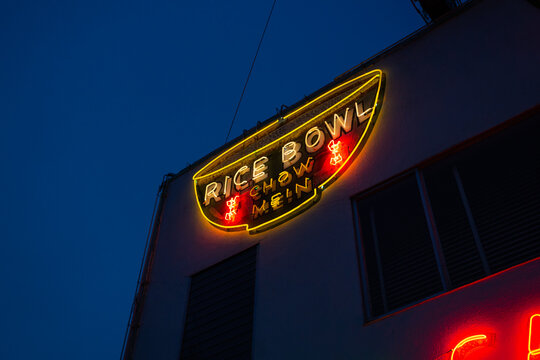 Rice Bowl neon sign at night, historic Chinese restaurant dating back to the 1940s in Lompoc, California, December 2019