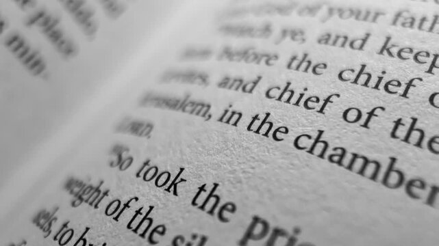 Moving along bible page macro close up scripture text christian faith spiritual reading holy bible background