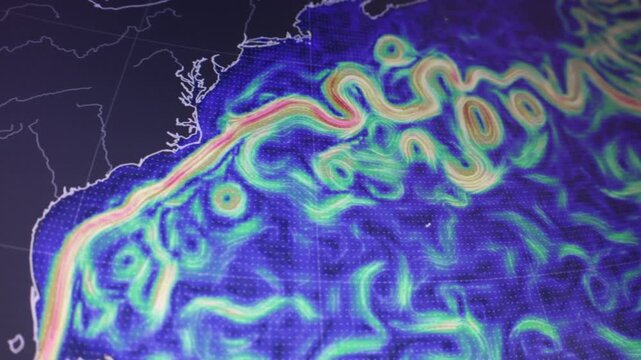 Dynamic hot Gulf Stream anomaly along the USA East Coast shown as a camera shot of a computer screen with pixels visible featuring oceanic atmospheric flow for climate weather science environmental