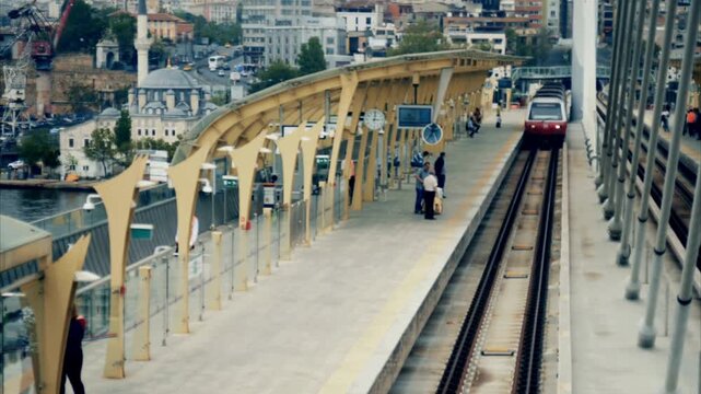 City Metro Train Arriving at Elevated Outdoor Station Platform