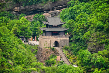Fototapeta premium Stone staircase leading to the ancient Jianmen Guanlou gate tower at the historic Jianmen Pass, Sichuan, China