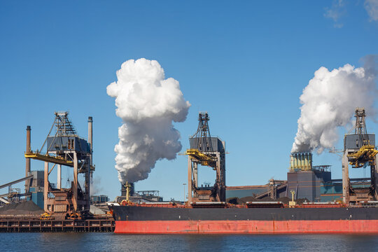 Tata Steel IJmuiden Industrial Harbor with Smoking Chimneys