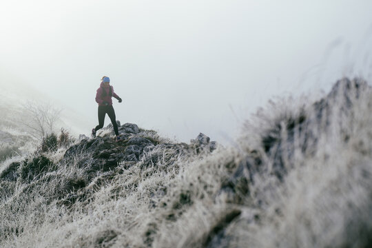 Trail Runner in Misty Mountain Landscape