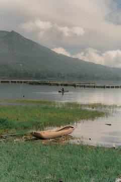 Scenic view of Mount Batur from Batur lake. Isolated by cloudy sky. Wide composition. Travel, nature, Landscape background