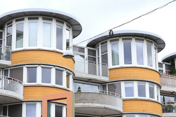 Fototapeta premium Amsterdam Land van Cocagneplein White and Yellow House Facades, Netherlands