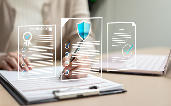 Businesswoman reviewing insurance contracts and financial documents, providing client advisory services for health and life insurance planning.