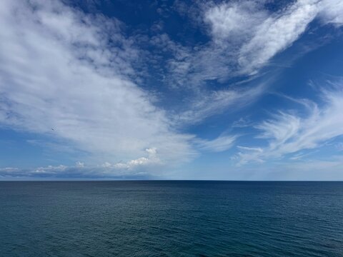 Open blue sea beautiful sky with clouds.