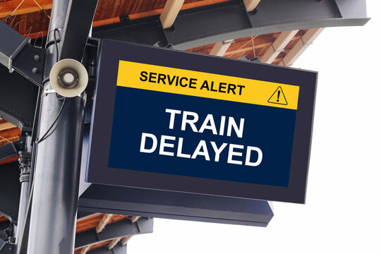 Train delayed service alert display at railway station. Passenger information board showing transportation disruption. Public transit delay warning and travel schedule changes