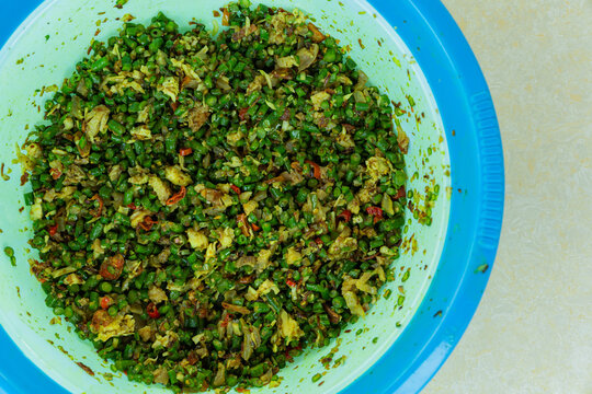 a Balinese traditional food called lawar featuring finely chopped long beans tossed with aromatic spices and seasoned grated coconut. Only available during Galungan and Kuningan's Day.