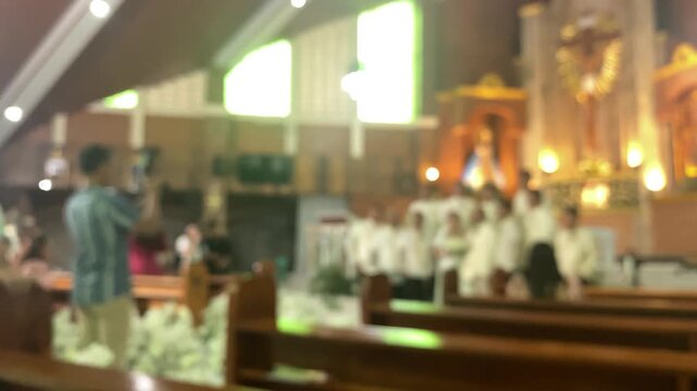 Wedding photoshoot at the altar of a chapel featuring the newlywed couple along with their entourage. Blurs