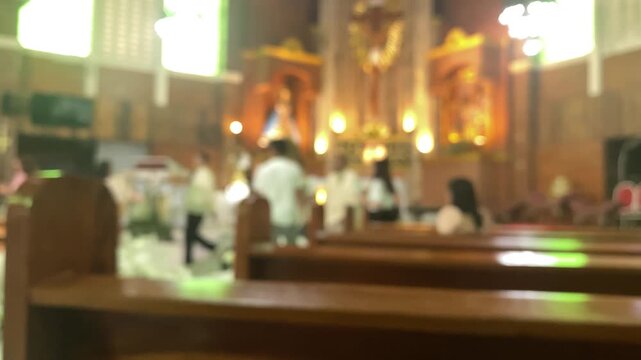 Wedding photoshoot at the altar of a chapel featuring the newlywed couple along with their entourage. Blurs