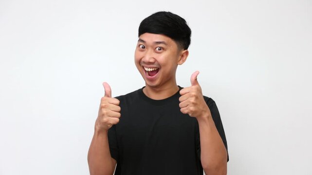 Man giving a cheerful double thumbs up