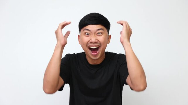Watch a man transition from pure shock to ultimate excitement, celebrating a big win with joy