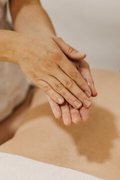 Close up of hands with massage oil. Rubbing with oil before massage.