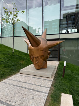 Bronze sculpture Starman by Martin Janecky looking down. Prague, Czech Republic