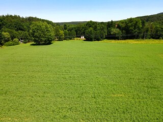 Obraz premium Land for sale and investment in aerial view. Include green field, agriculture farm. That real estate or property. Plot of land lot