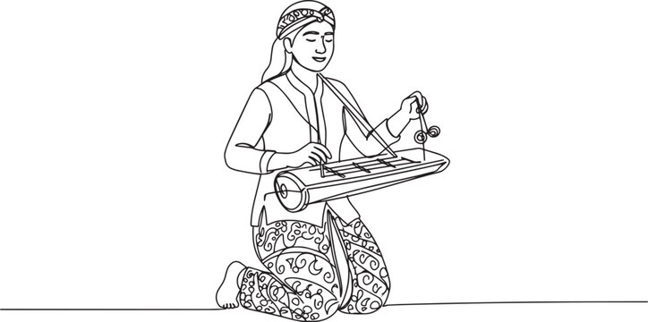 A person playing a traditional Indonesian musical instrument, the gender.