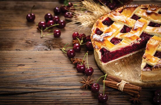 Delicious homemade cherry pie on the wooden table	