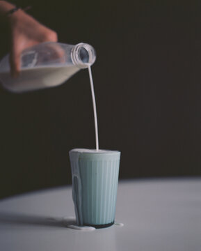 Milk pouring by hand