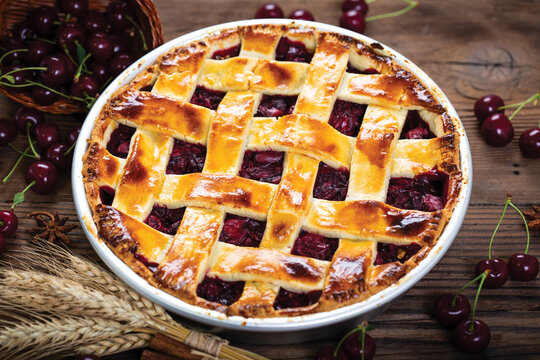Delicious homemade cherry pie on the wooden table	