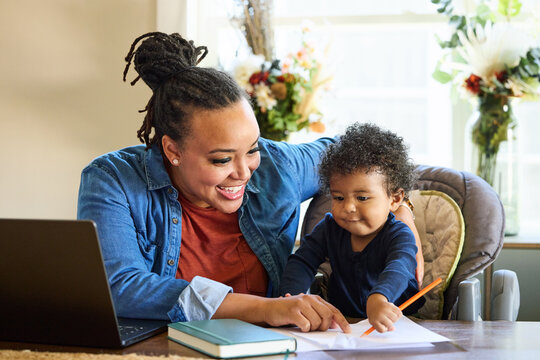 Mother and Child Share Creative Time in Home Office