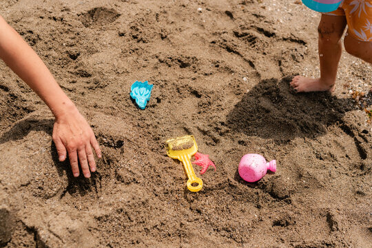 Father playing with son on the beach