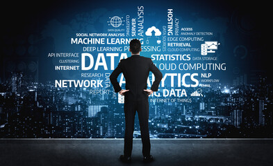 Fototapeta premium A business professional stands in front of a futuristic urban skyline, contemplating data analytics concepts. The image emphasizes technology and innovation in analytics. Tessel