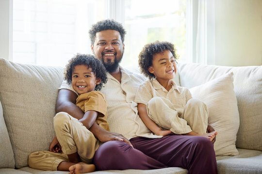 Father Enjoys Time With Children on the Sofa