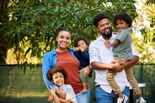 Family Enjoying Time Outdoors With Children at Park