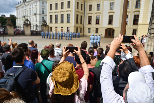 Tourists Taking Pictures with Phones at Prague Castle in Czech Republic