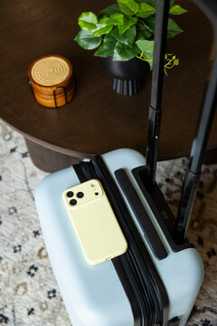 travel lifestyle with cell phone luggage still life 