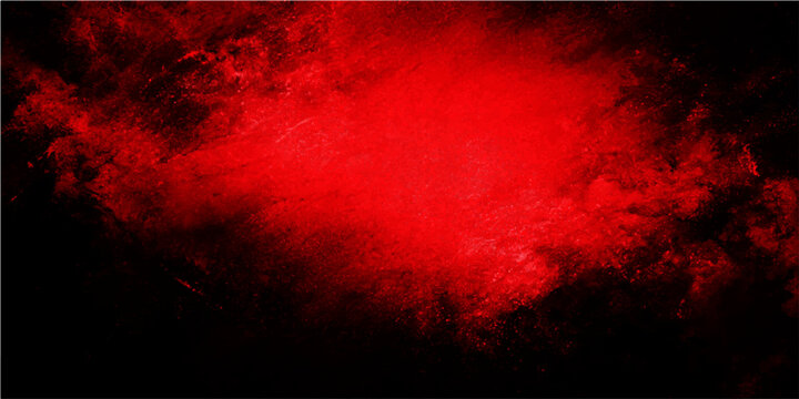 Intense abstract red explosion of vibrant color on a stark black background, creating a dramatic and energetic visual effect