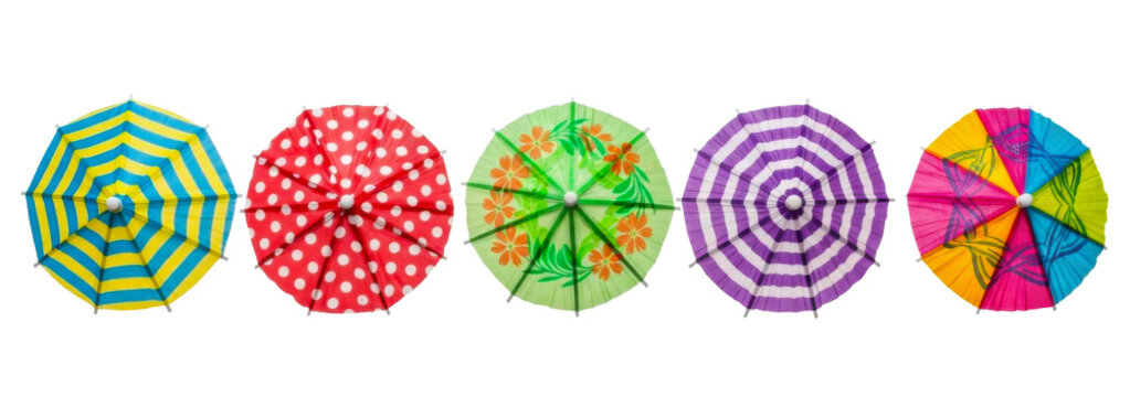 Top view of five cocktail umbrellas isolated on transparent background.