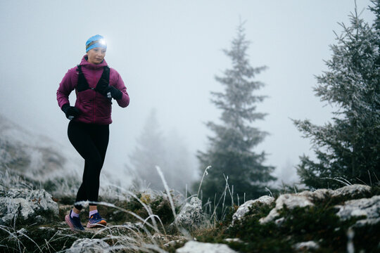 Trail Runner in Misty Mountain Landscape
