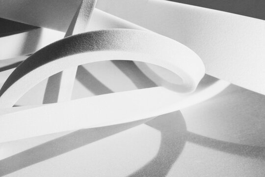 White geometric shapes, abstract background, studio shot photo