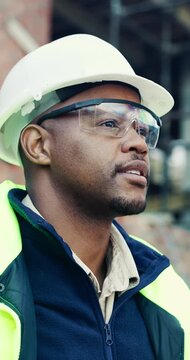 Hard hat, thinking and visor with black man on construction site for engineering or property development. Architecture, goggles and helmet with industrial worker outdoor for inspiration or planning