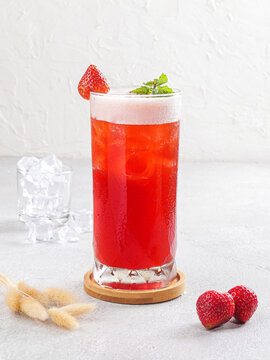 Fresh Strawberry Iced Drink with Mint Leaves and Crushed Ice, Bright Red Fruity Summer Refreshment