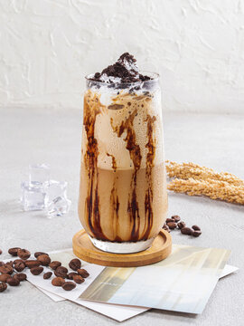 Iced Chocolate Coffee Latte with Cream and Chocolate Drizzle in a Clear Glass
