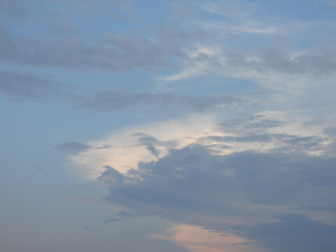 Evening sky, with storm clouds, over Kent County, Delaware. Clouds highlighted by the remnants of sunlight at sunset. Tranquil, enlightening background.