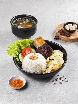 Authentic Indonesian Food Platter with Steamed Rice and Side Dishes
