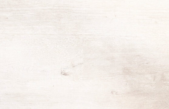 White washed wood texture background with visible grain and knot. Light rustic wooden plank surface close-up, warm tone..