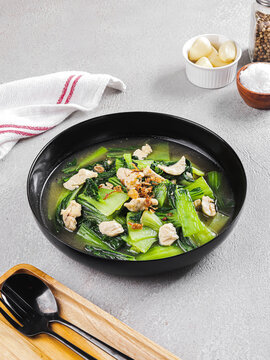 Healthy Homemade Chicken & Bok Choy Soup in Black Pan