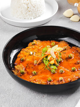 Spicy Tomato Egg Chicken Rice Bowl Served in Clay Pot with Steamed Rice